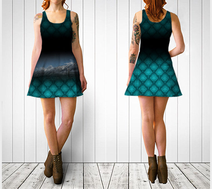 Mountains at Canmore on a dark dress with aqua detailed swirly pattern